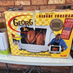 NEVER USED IN THE BOX  GEORGE JR LEAN MEAN FAT ROASTING MACHINE