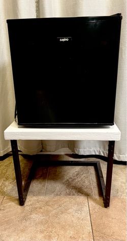 Sanyo Black Mini Fridge and black and white side table
