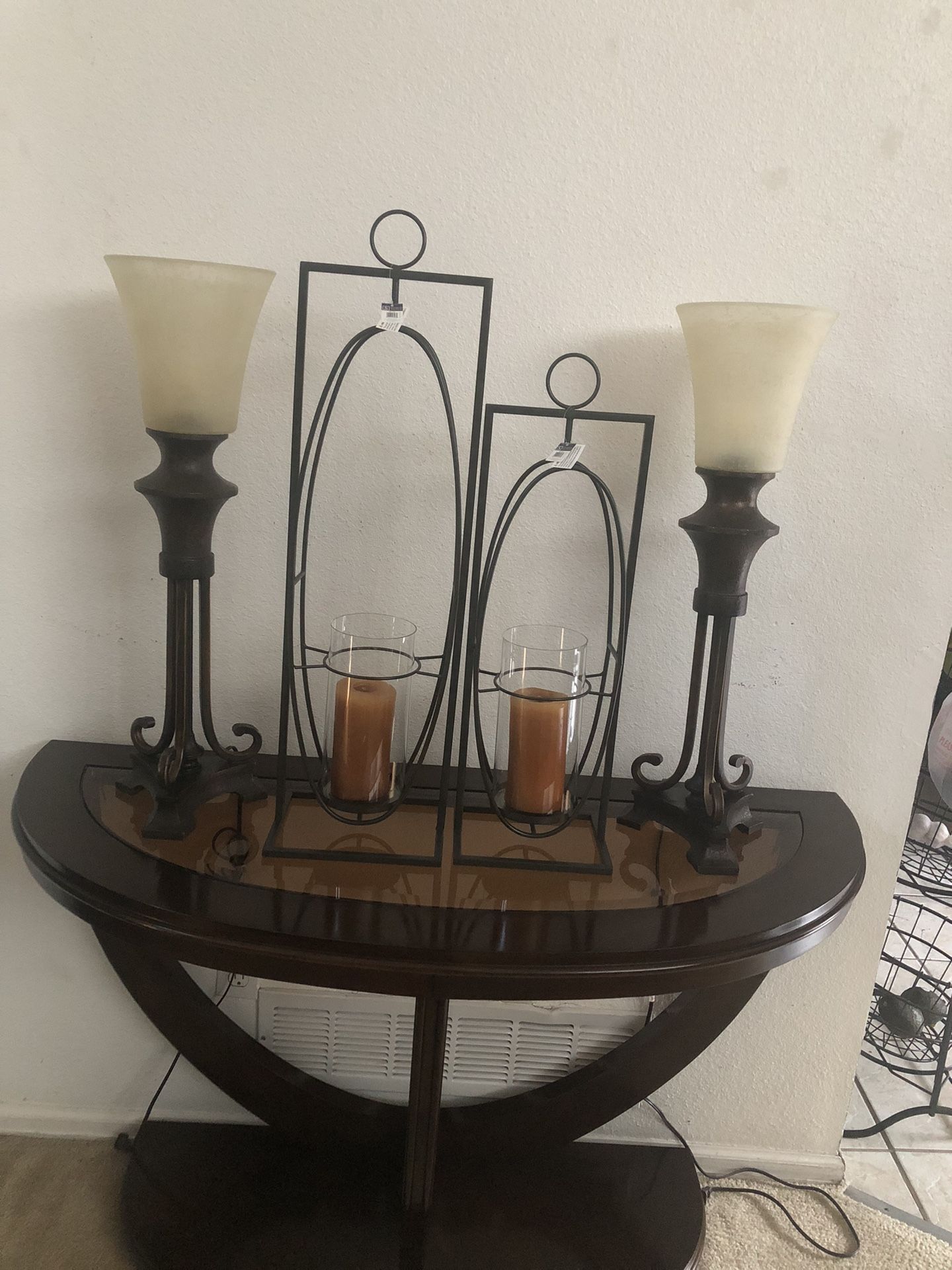 two lamps and two decorative candle holders