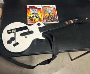 Wii guitar and 2 games