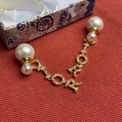 Christian Dior Gold Finished Milky Pearl Dior Logo Letter Dangle Earrings
