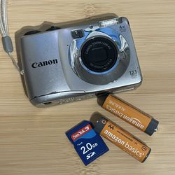 Canon Powershot A1200 Silver Digital Camera - Tested Works  Flash zoom video photo all working. Has some cosmetic wear. See pics.  Batteries and memor