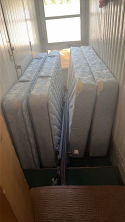 2 twin bed frames, 2 twin mattresses, 2 twin bed frames.