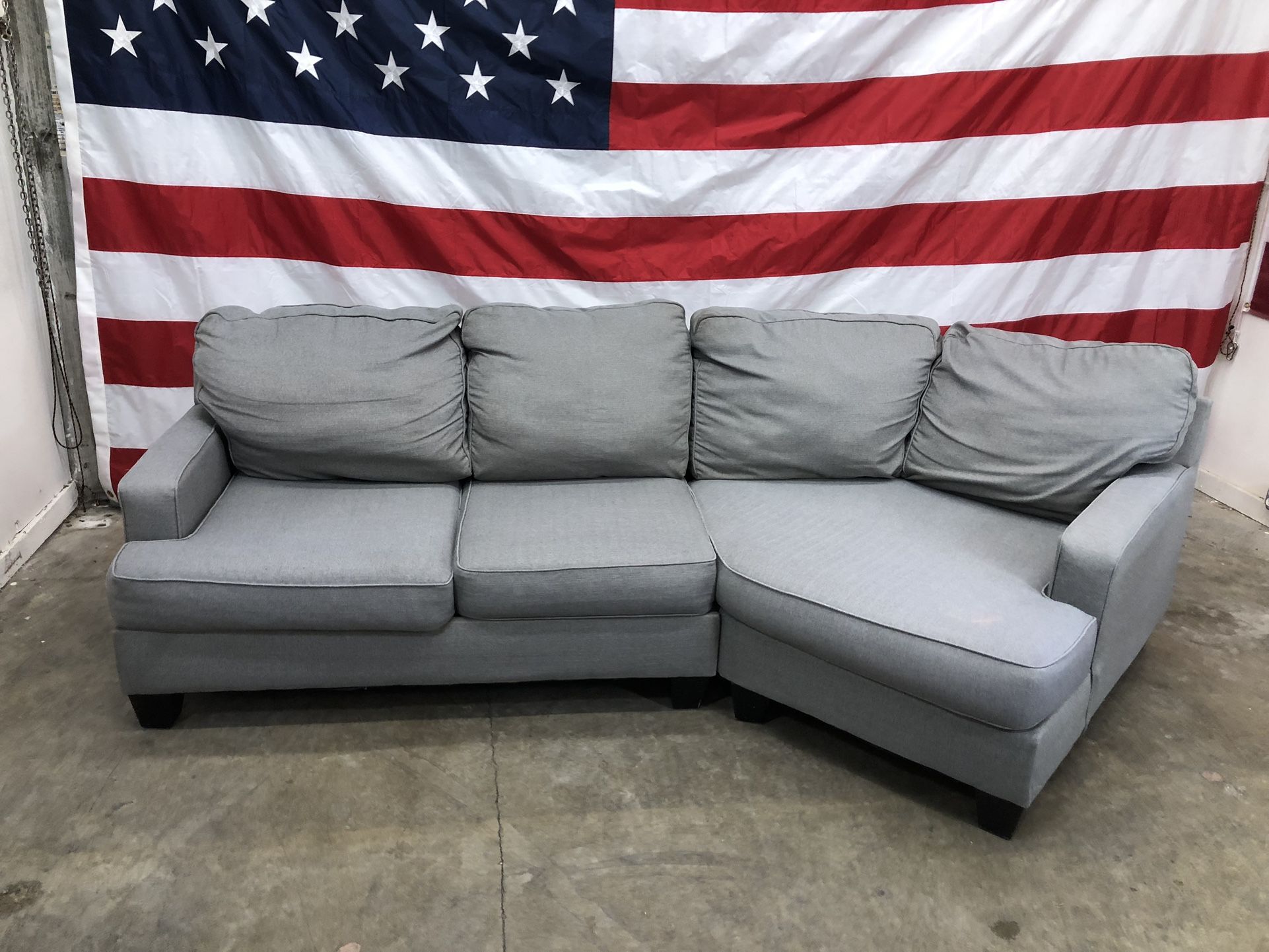 Free Delivery - Grey Sectional With Cuddler
