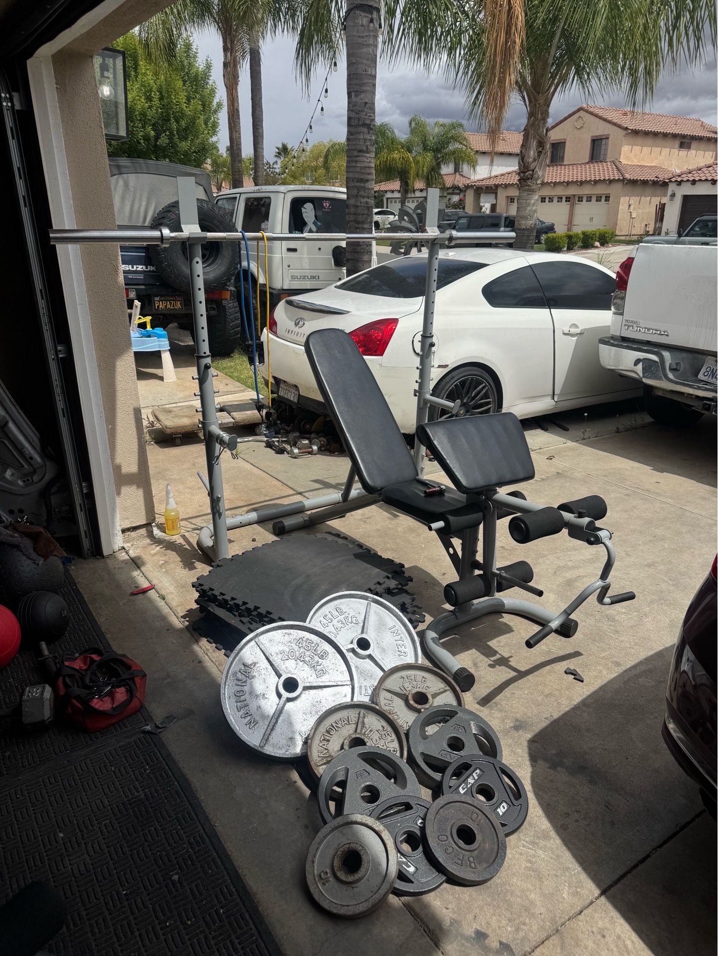 Bench press/squat rack with 230lbs of Olympic weights plus 7ft 40lbs bar plus curl bar and mats
