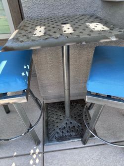 Heavy patio table with 2 chairs