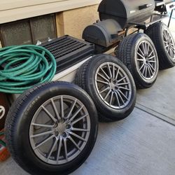 Subaru 5x100 17x8 wheels and new gt tires