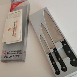 J.A. Henckels International Forged Pro 3-Piece Starter Knife Set . 
Pre-owned, good shape, in original package. The smallest, paring knife, 
has a cra