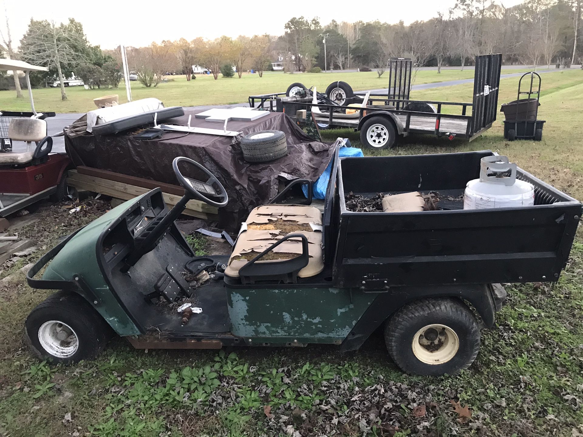 Two gas workhorse golf carts