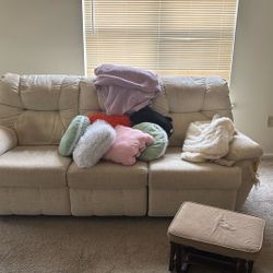 White Couch With Assorted Pillows 