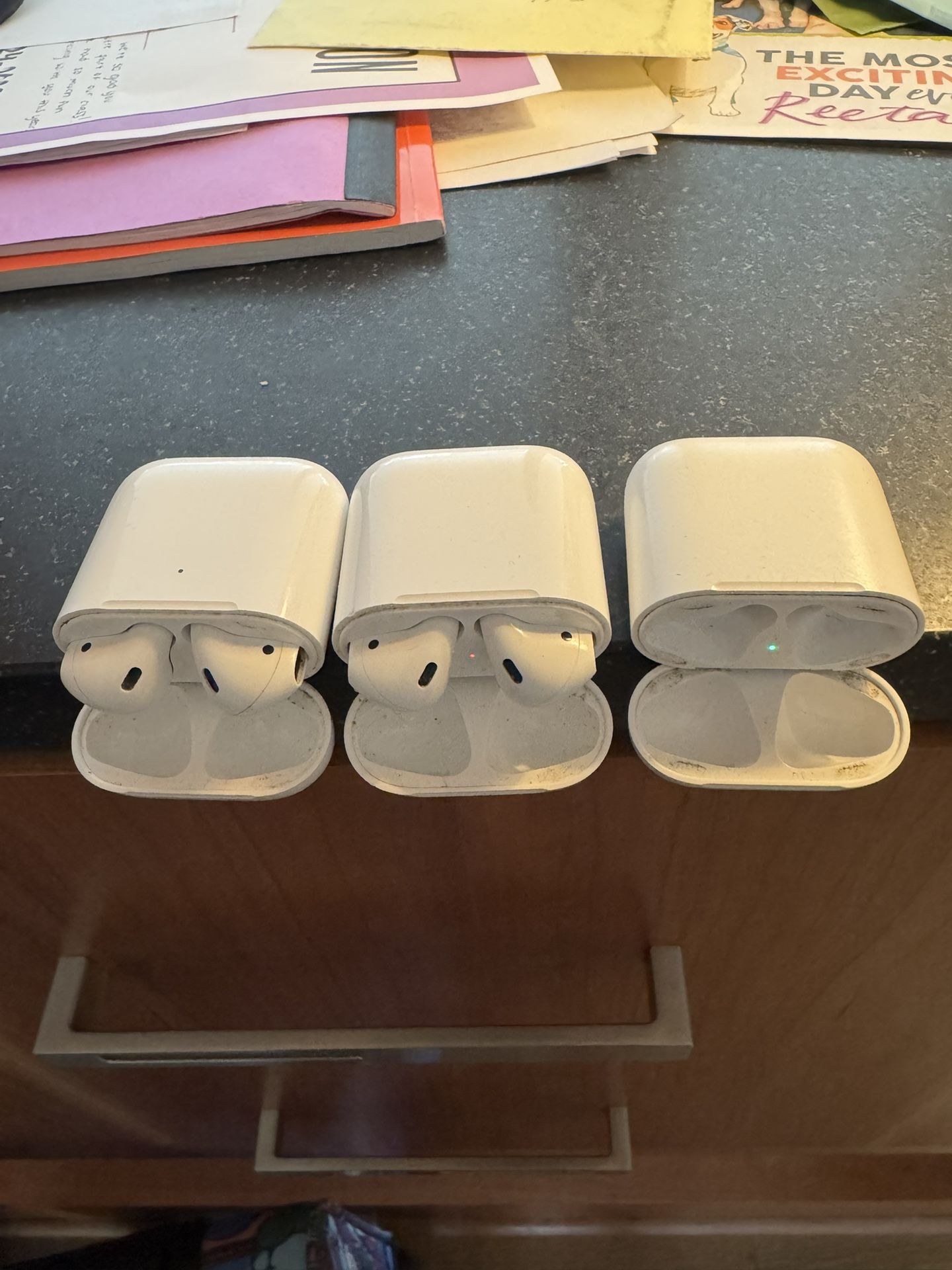 2 Pairs Of AirPods 2nd Gen and 3 Charging Cases (one Supports Wireless)