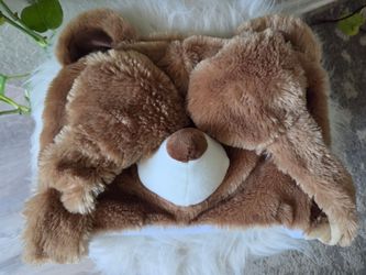 Child bear hat hanging paws