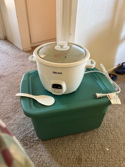 Brand new AROMA rice cooker, never used. No original box, but the cooker, lid, and rice paddle are included.
