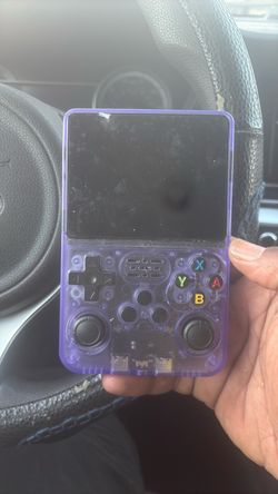Game console R36S, purple, hand held.
