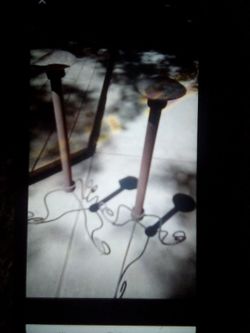 PAIR OF 50 YEAR OLD RUSTIC METAL FLOOR CANDLE HOLDERS