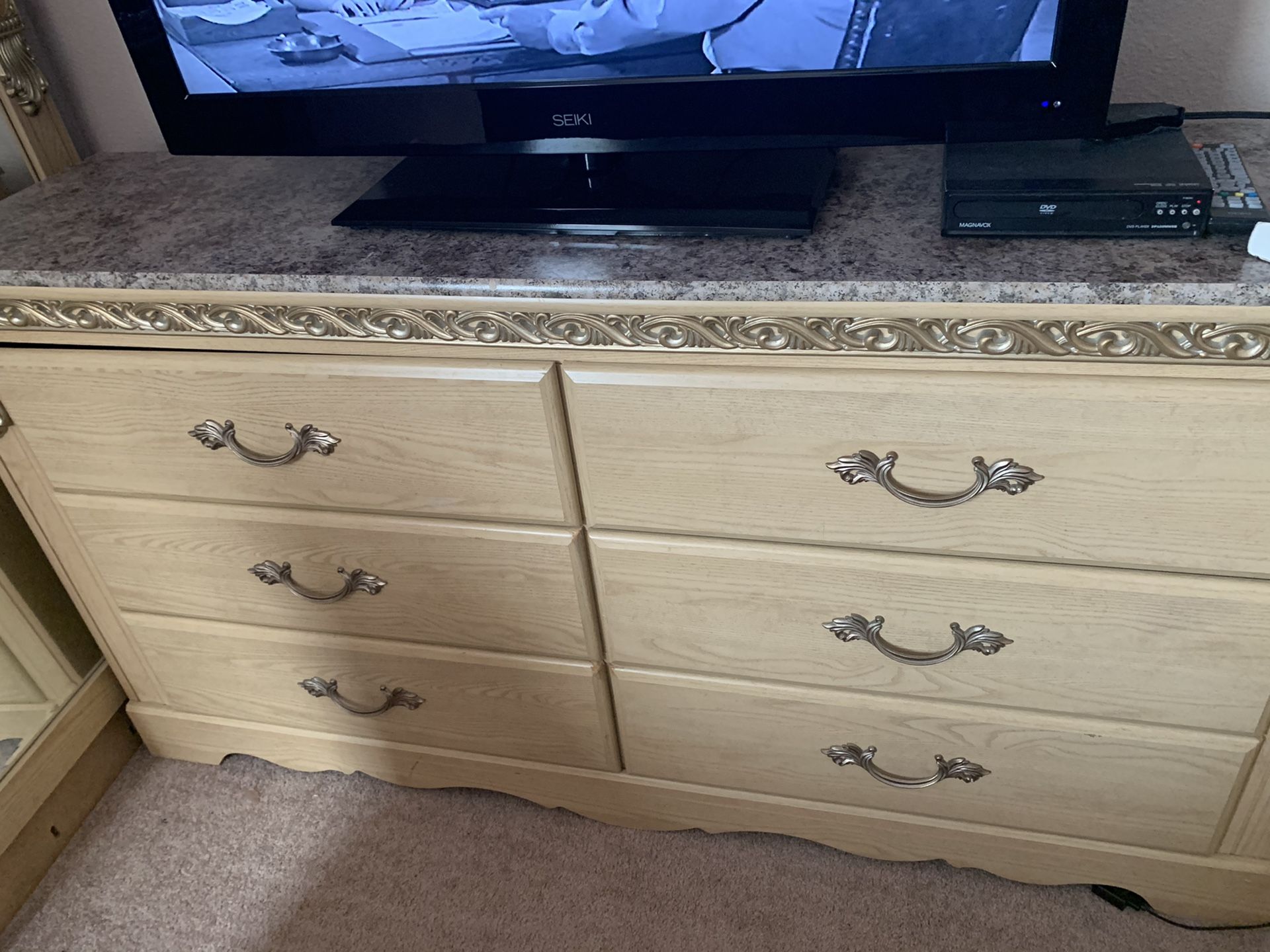 Beige queen size bedroom set with dresser and mirror chest and 1 night stand