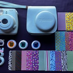 Turquoise polaroid instax camera