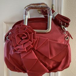   Leather Handbag - (Red).  Retail $365, Bought and never used.  2 Magnetic  and 1 Outside Pockets,  Inside  Has One Zippered And Two Open Pockets. 