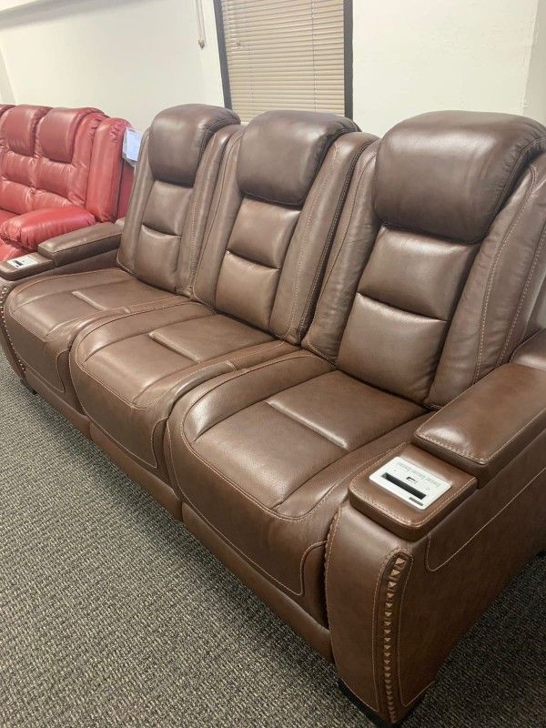 The Man-Den Gray Power Reclining Sofa And Loveseat
Ashley Furniture $10 Down Payment And Financing Available