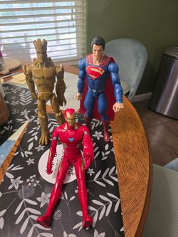 Superman, ironman and groot action figures