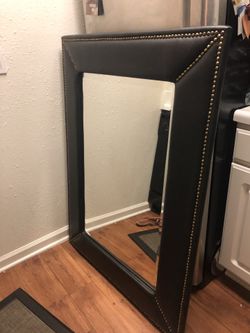 Black mirror whit leather around size 36 inches wide wide 50 inches long ( heavy)
