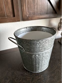 galvanized metal bucket featuring decorative side handles