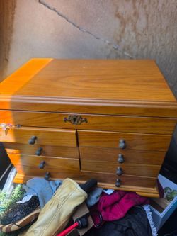 Wooden jewelry box with drawers