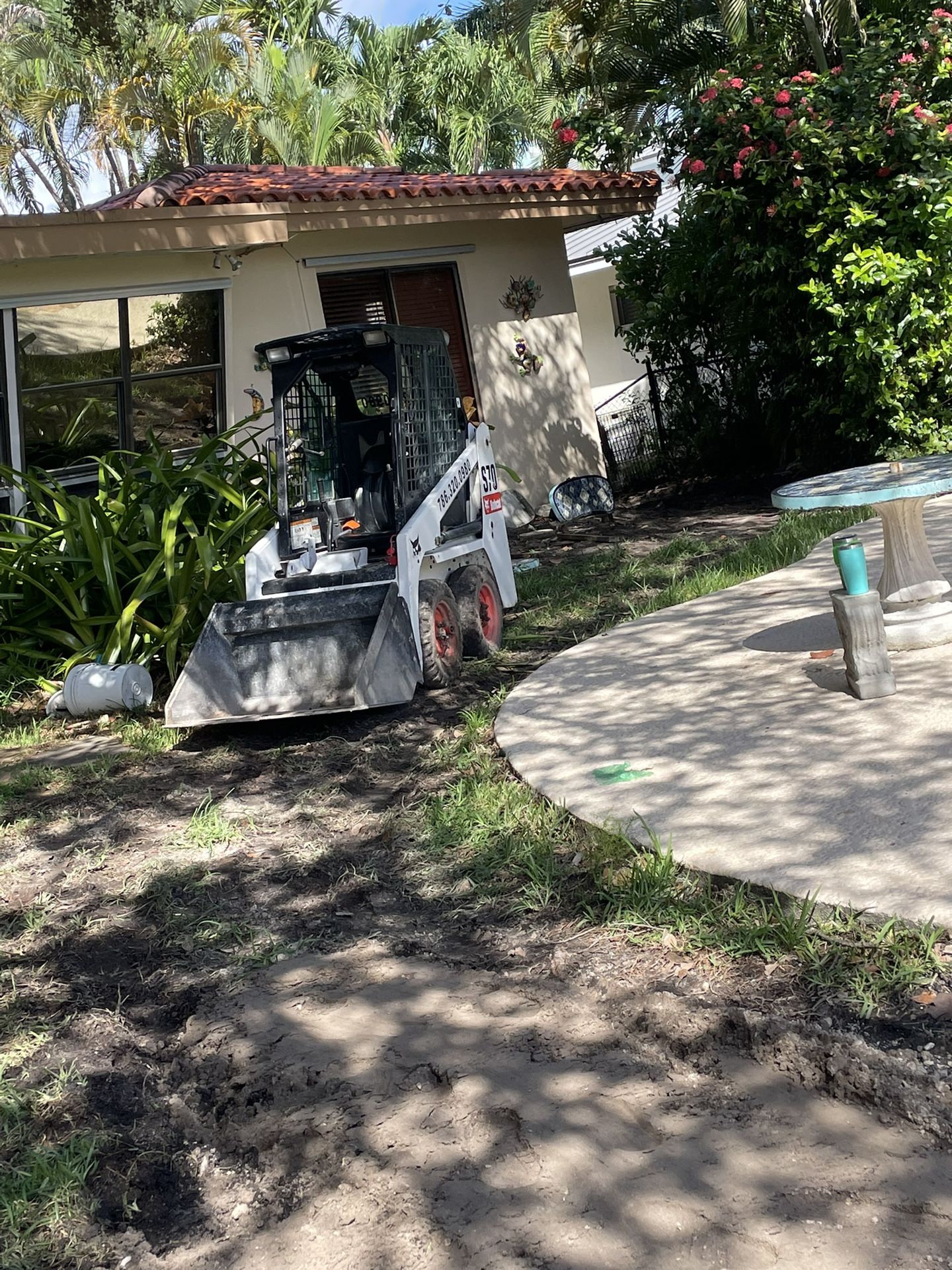 Bobcat And Excavator