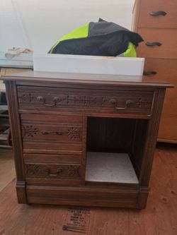 Wood Kitchen Storage Cabinet with Marble Backsplash