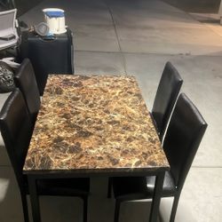 I have two of the same tables selling them each for $50 both in great shape and come with four chairs each