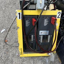 (2) 24v battery chargers for forklift or pallet jack model #SVR5/6 with 25amps There’s 2 same chargers in one yellow metal protective enclosure