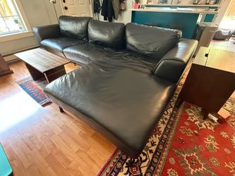 Black leather sectional couch