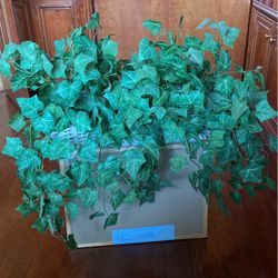 Artificial Green Plant In a White Basket For $8.00