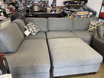 Gray sectional with ottoman