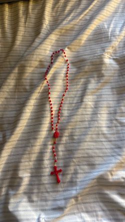 Red rosary with Jesus face