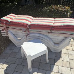 White Plastic Sun Lounges With Striped Cushions