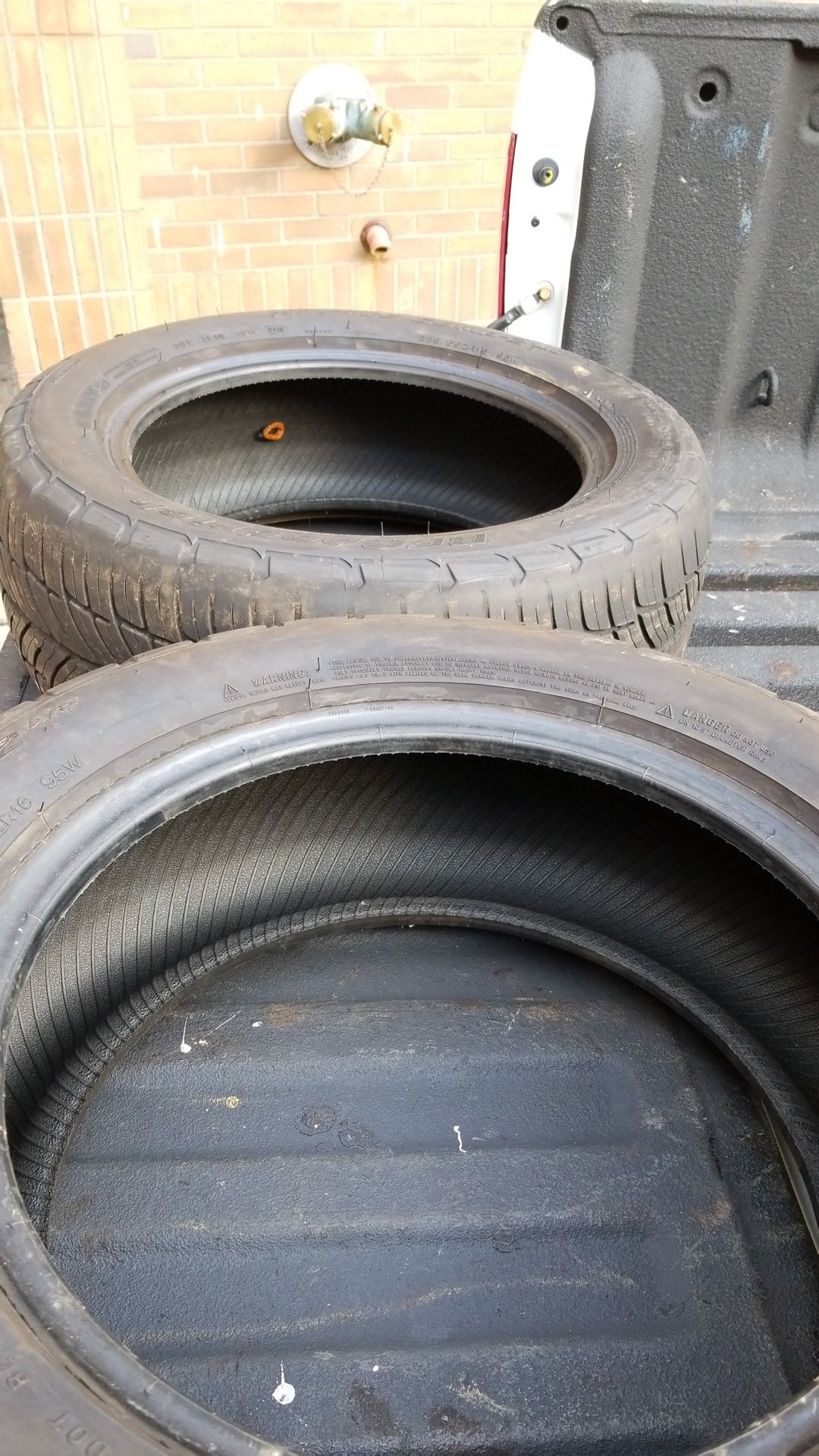 2 BFGoodrich G-Force comp 2 A/S tires one tire has a plug