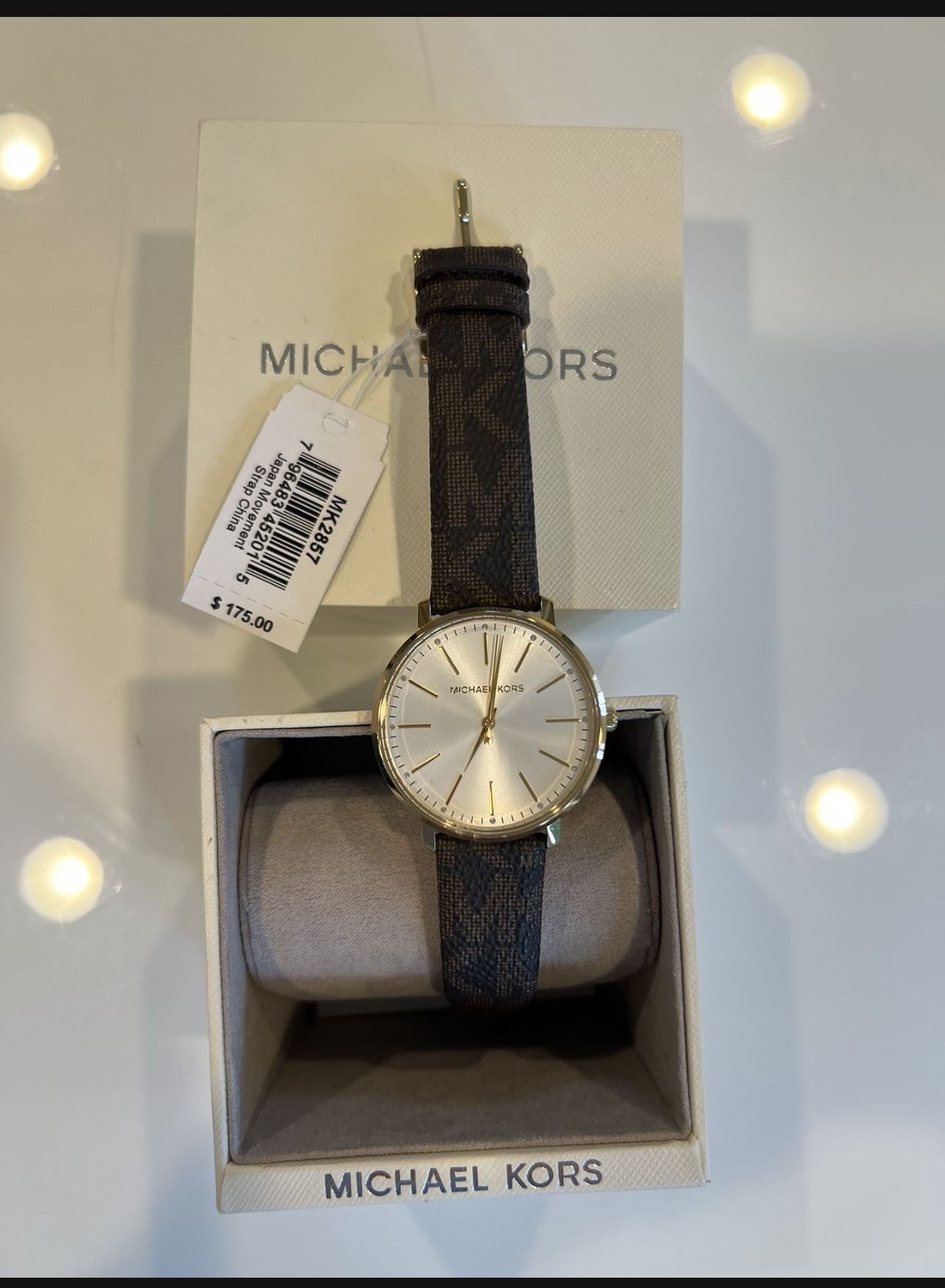 Michael Kors stainless steel watch with leather logo band. Great condition