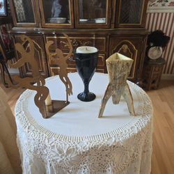 Vintage wine, goblet space shuttle and dancing women.