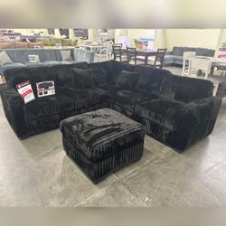 Black jumbo corduroy sectional sofa with ottoman 