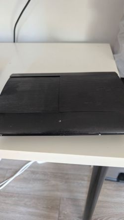 PlayStation 3 slim w/games and controllers