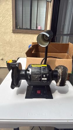 Bench grinder with lamp