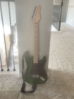 Glarry GST Electric Guitar in a green finish.
