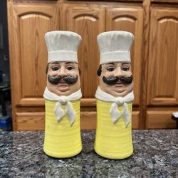 Ceramic Vintage Chefs  pair of Salt and Pepper Shakers.  Size approximately 7 inches tall. Preowned.  No stoppers Has been on display in a cabinet wit