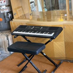 Yamaha keyboard, a Proline stand, and a Proline bench