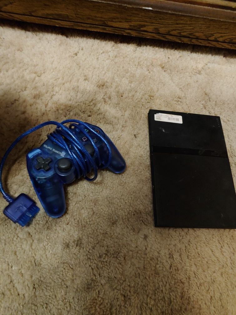 Used PlayStation 2 , controller and 19 games