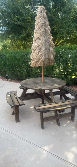 Round outdoor table with benches