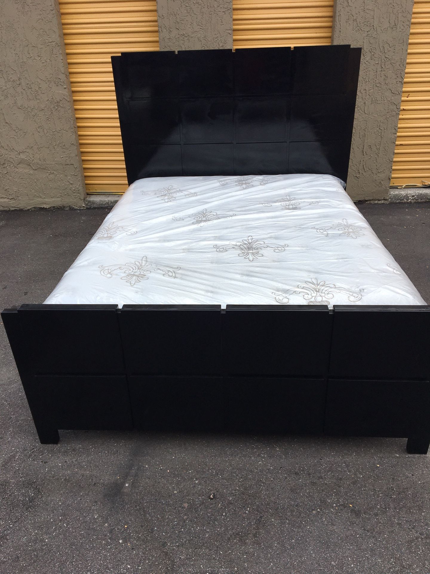 Black solid wood-bed frame with brand new Queen size pillows top mattress and box spring in plastics