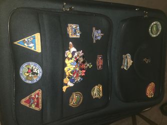 Suitcase with Disney patches