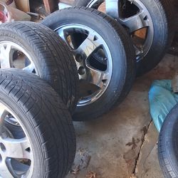 4 silver rims and tires
